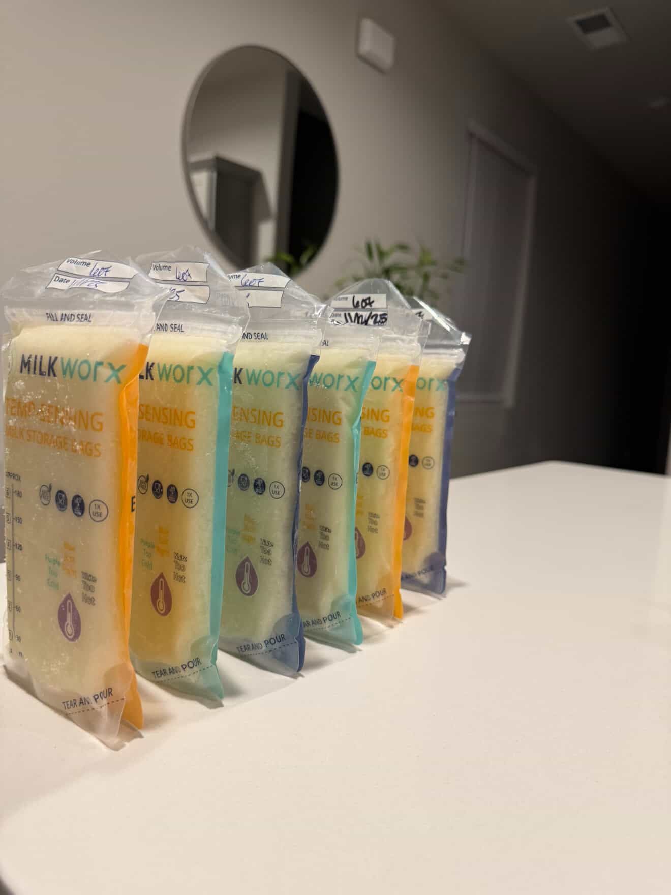 Row of packaged products on a white surface with a neutral background